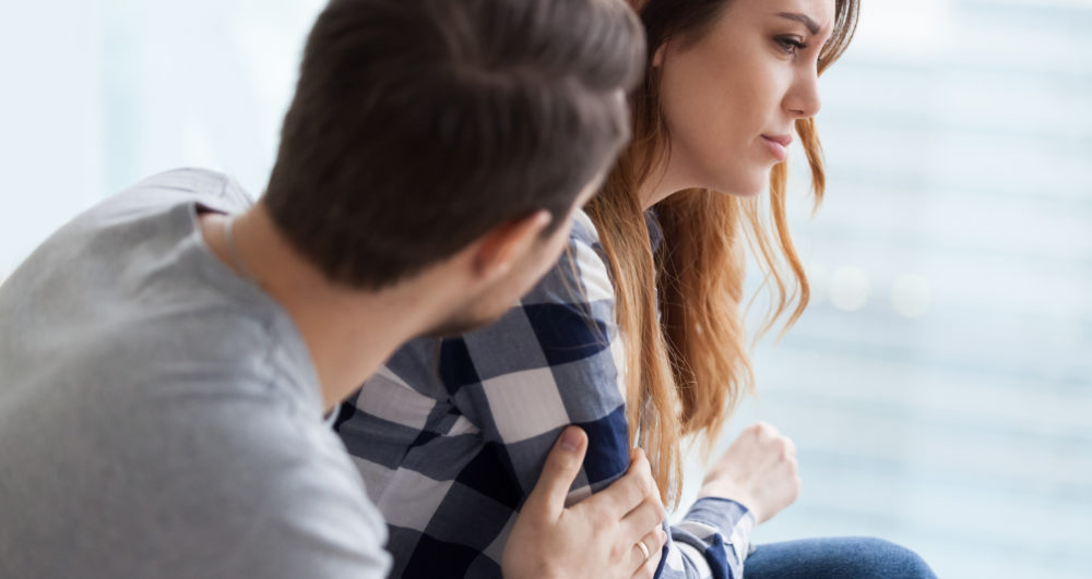 Caring Man Comforting Upset Wife After Fight